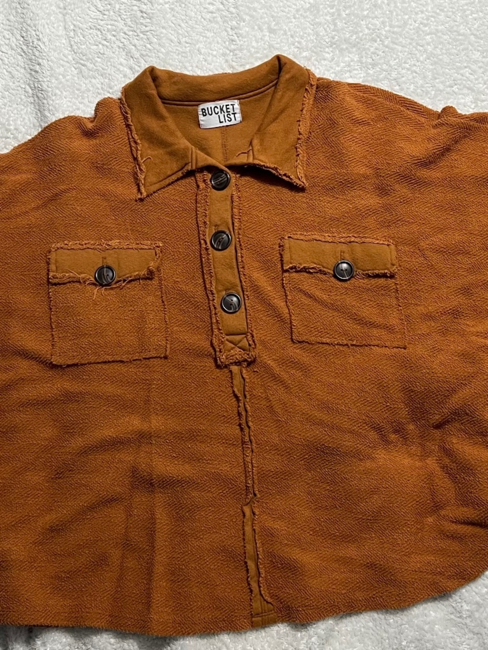 Boutique poncho type shirt